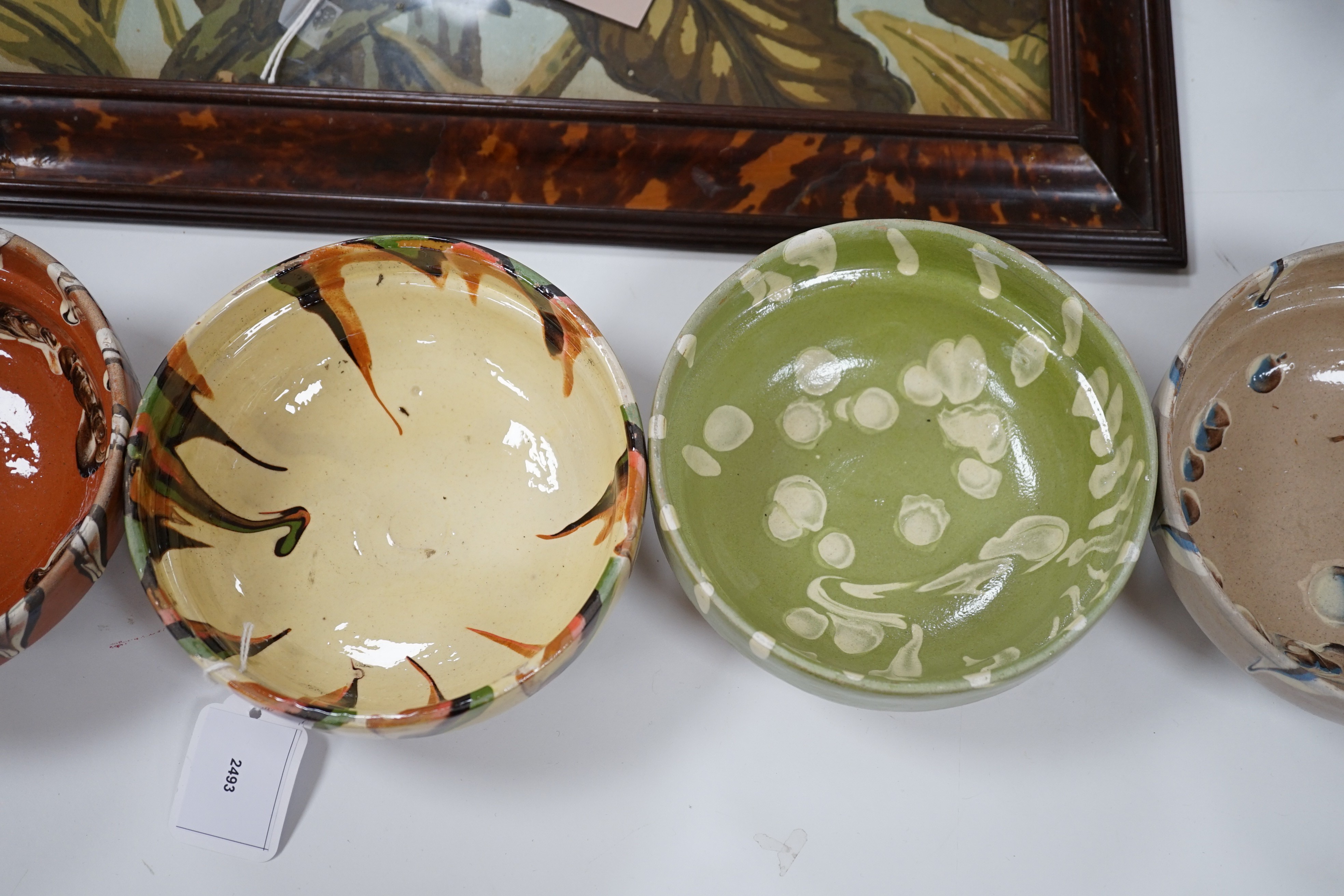 A group of six continental pottery slip decorated bowls, 16 cms diameter